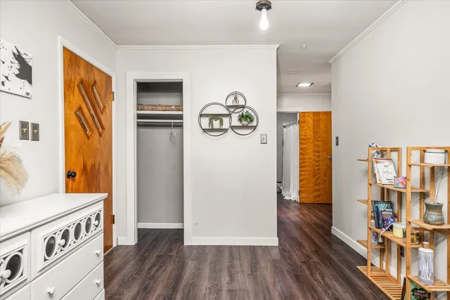 a view of an entryway with wooden floor