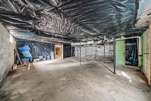 a view of empty room with wooden ceiling