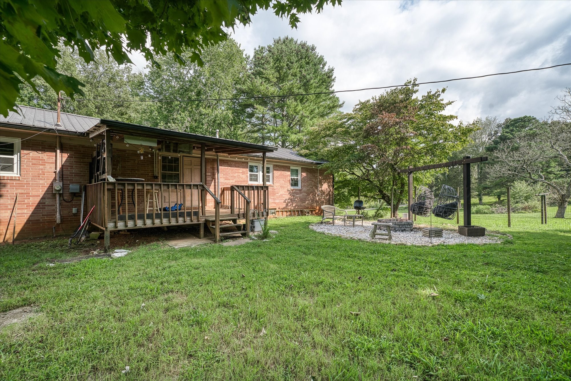 180 Frank Anderson Road Sparta, TN 38583 - Photo 24 of 45 a view of backyard with a garden and deck