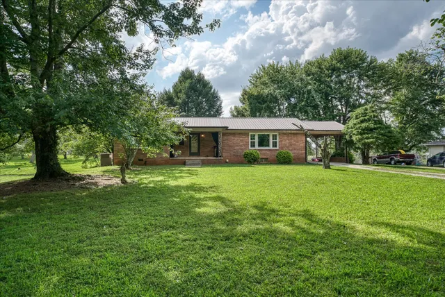 a front view of a house with a yard