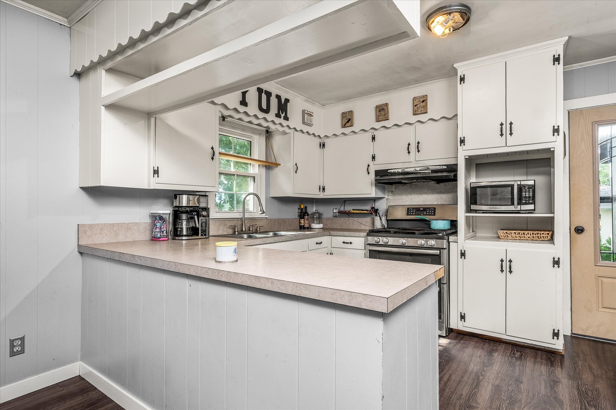 180 Frank Anderson Road Sparta, TN 38583 - Photo 4 of 45 a kitchen with stainless steel appliances granite countertop a sink stove and white cabinets