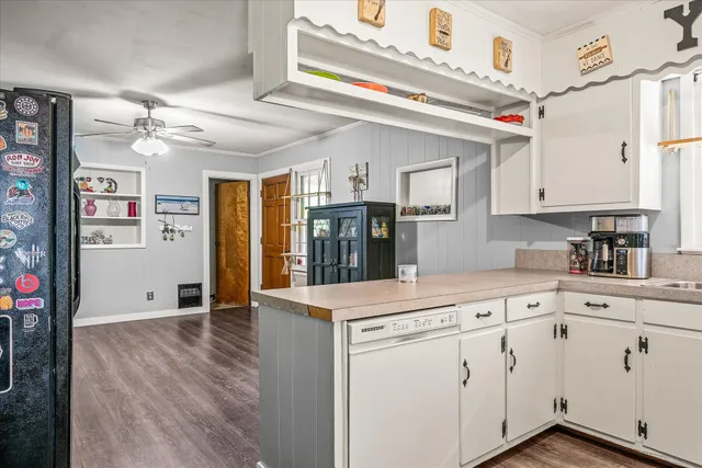 a kitchen with stainless steel appliances granite countertop a sink and cabinets