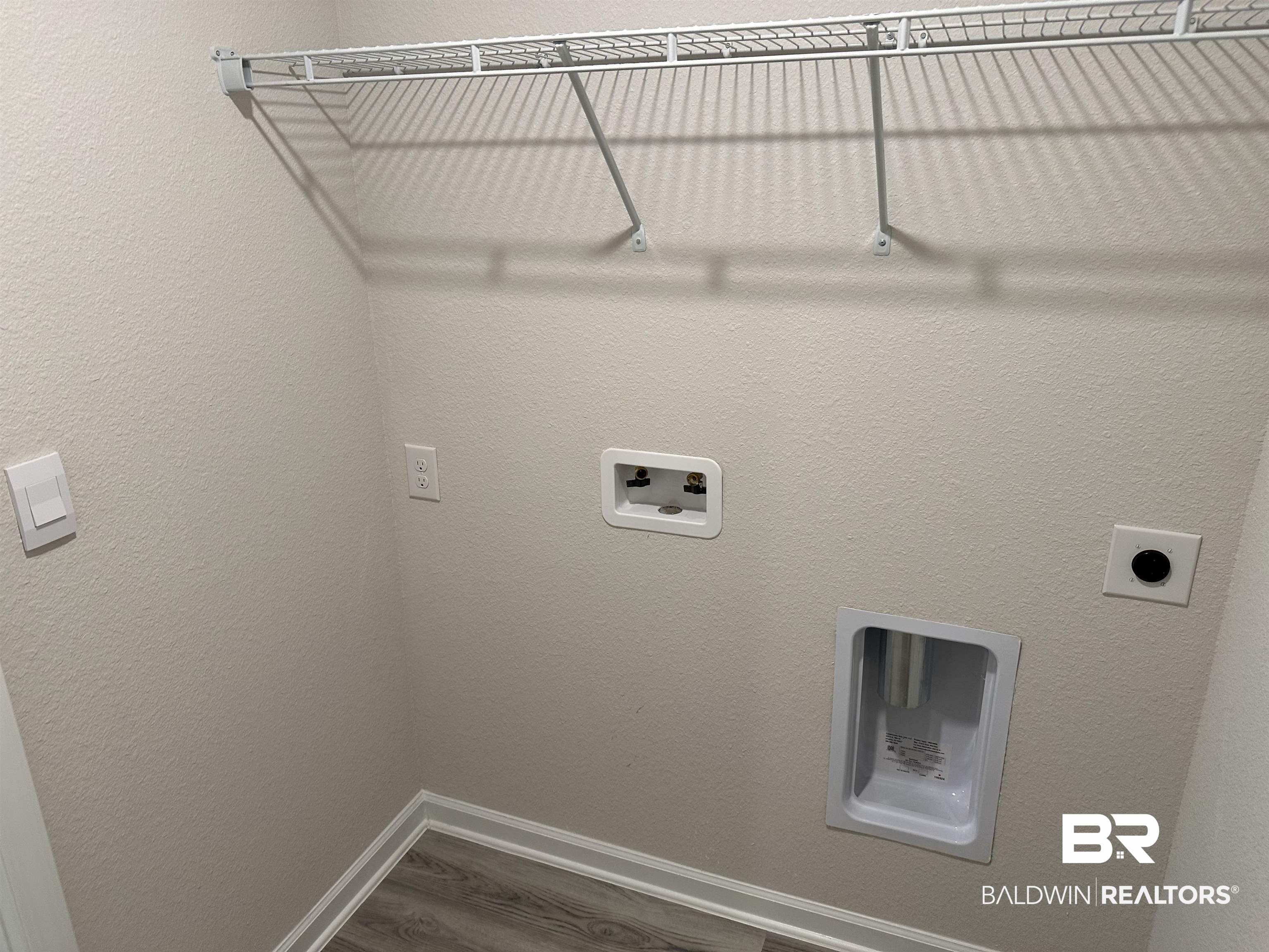 1238 Hayward Loop Foley, AL 36535 - Photo 20 of 46 Laundry room with hookup for an electric dryer, hookup for a washing machine, and hardwood / wood-style flooring