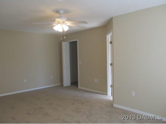 304 Mariners Gate Drive Edgewater, FL 32141 - Photo 15 of 16 a view of a chandelier in big room and chandelier fan