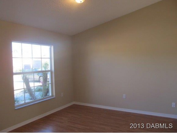 304 Mariners Gate Drive Edgewater, FL 32141 - Photo 7 of 16 an empty room with a window