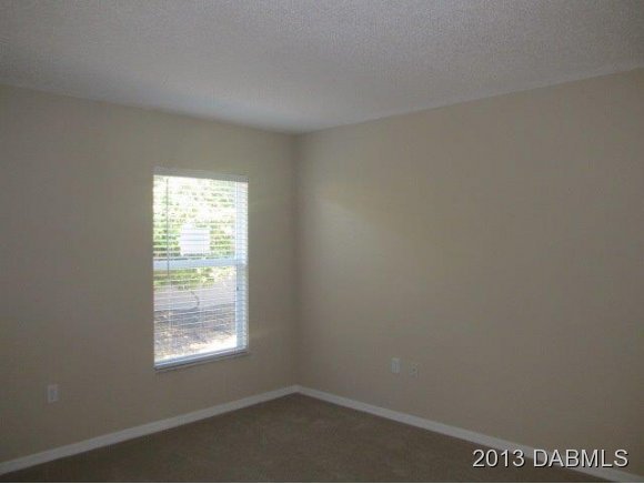 304 Mariners Gate Drive Edgewater, FL 32141 - Photo 9 of 16 an empty room with a window