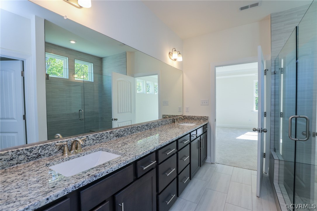 3806 Belspring Road Chester, VA 23831 - Photo 8 of 14 a bathroom with a granite countertop sink and a mirror