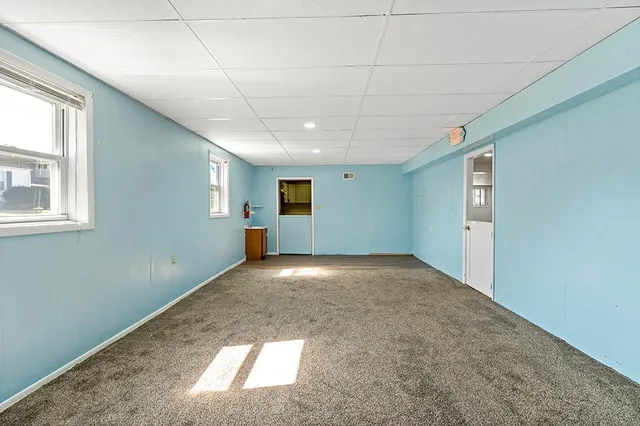 a view of empty room with windows