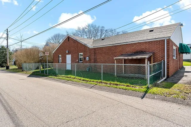 a front view of a house with garage