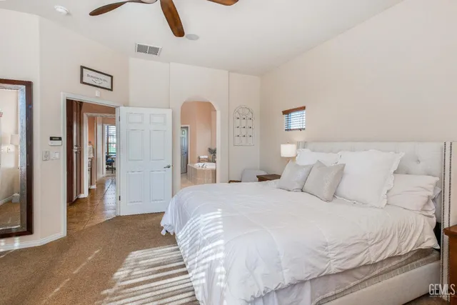 a bedroom with a bed and a couch