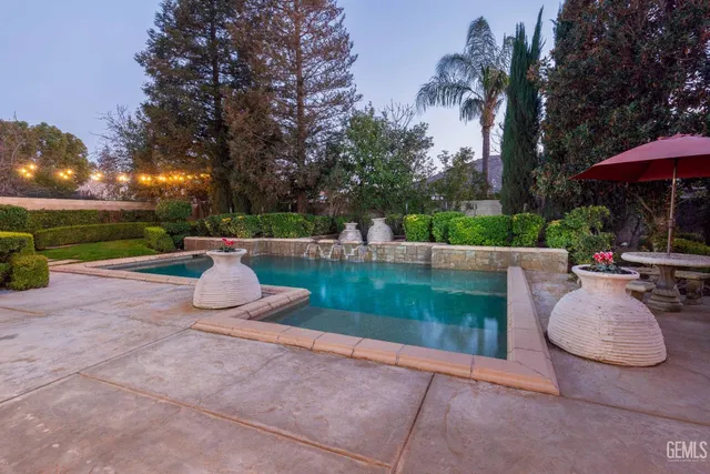 a view of a swimming pool with a patio