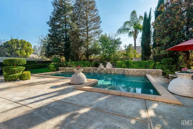 a view of a backyard with large trees