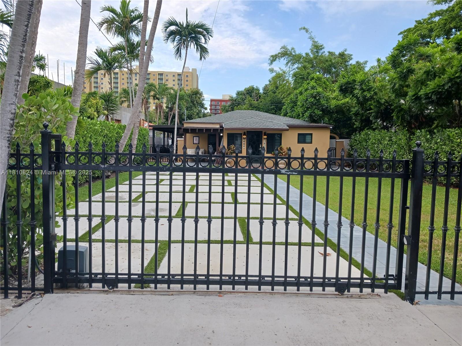 3429 Southwest 23rd Terrace Miami, FL 33145 - Photo 1 of 32 a view of a wrought iron fences in front of house