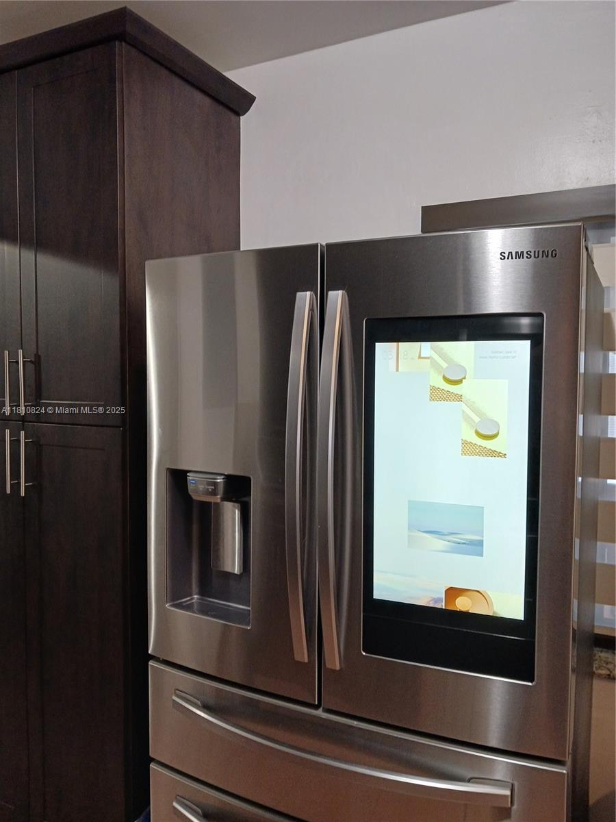 3429 Southwest 23rd Terrace Miami, FL 33145 - Photo 14 of 32 a refrigerator freezer sitting inside of a kitchen