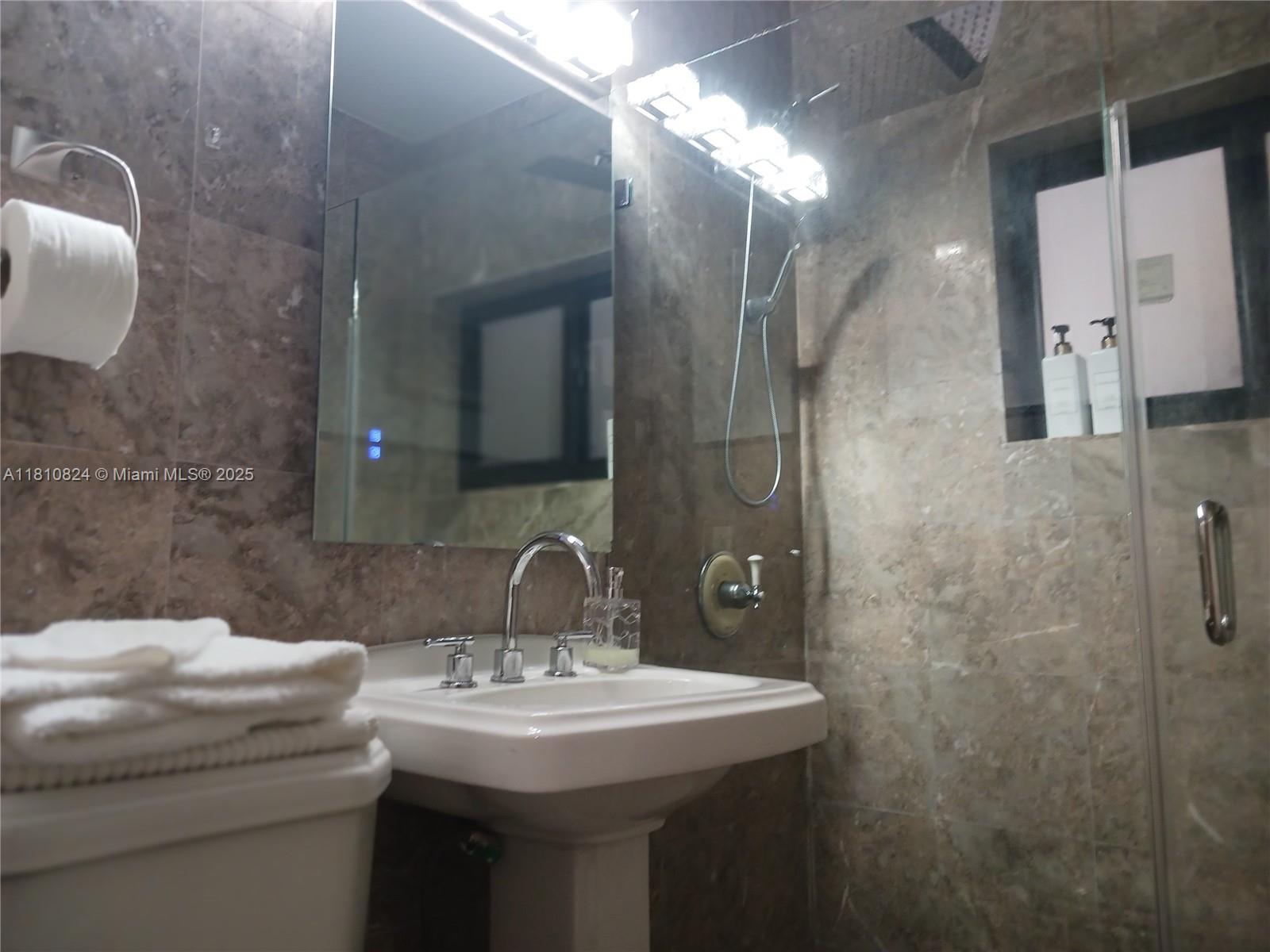 3429 Southwest 23rd Terrace Miami, FL 33145 - Photo 20 of 32 a bathroom with a sink and mirror