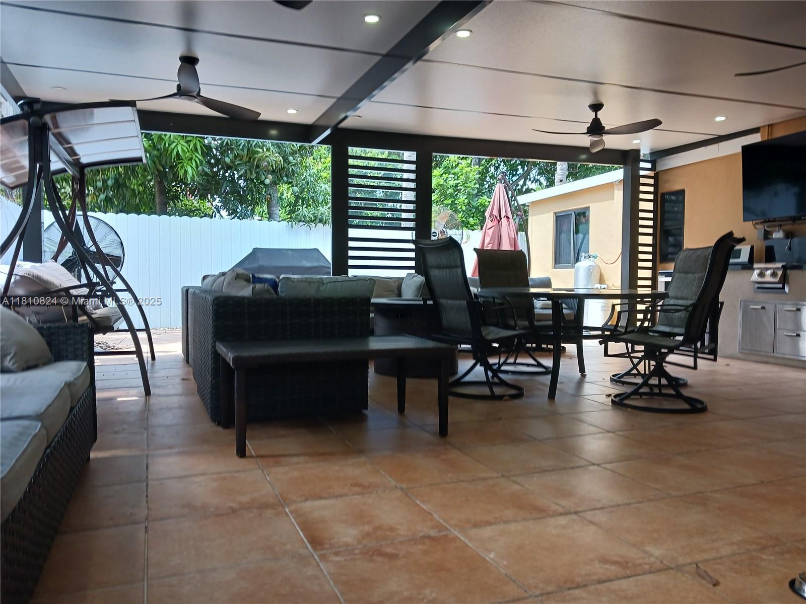 3429 Southwest 23rd Terrace Miami, FL 33145 - Photo 30 of 32 a building outdoor space with patio furniture and potted plants