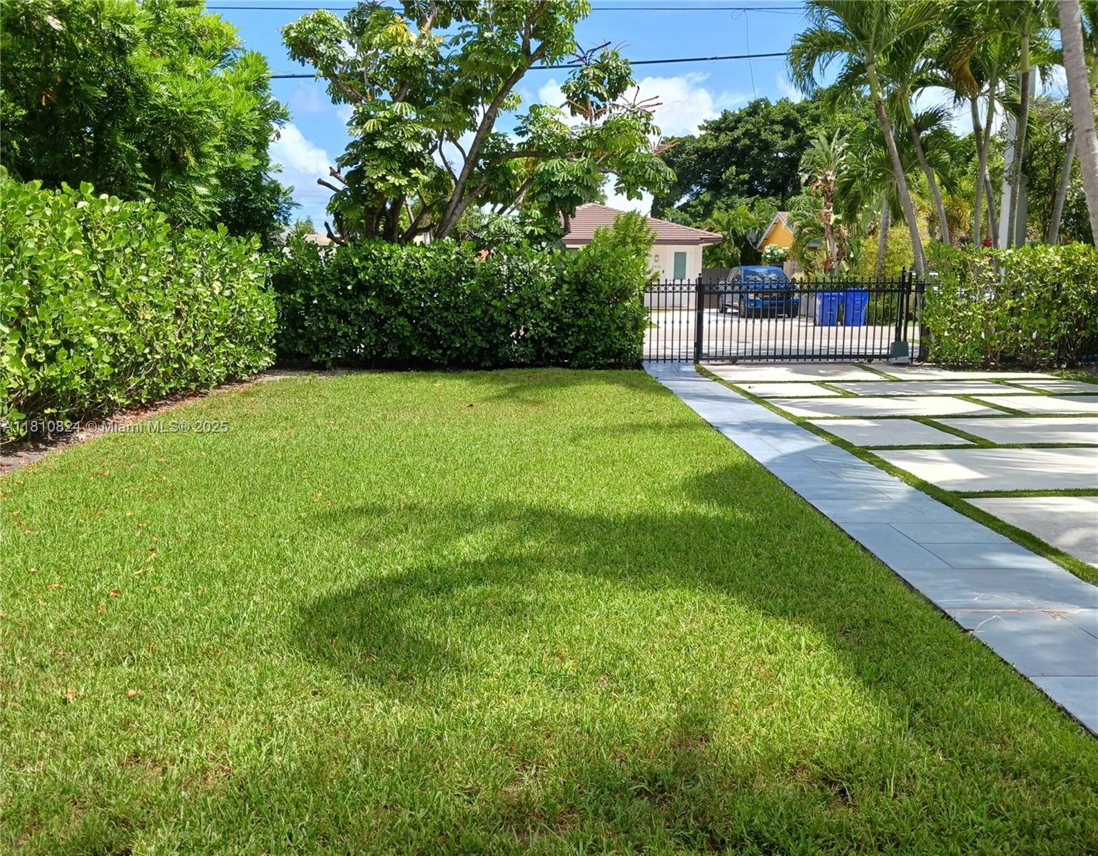 3429 Southwest 23rd Terrace Miami, FL 33145 - Photo 7 of 32 a view of a garden with a bench