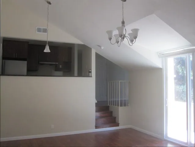 a view of a hallway with a chandelier