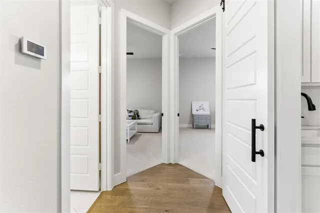 a view of a bathroom from a hallway