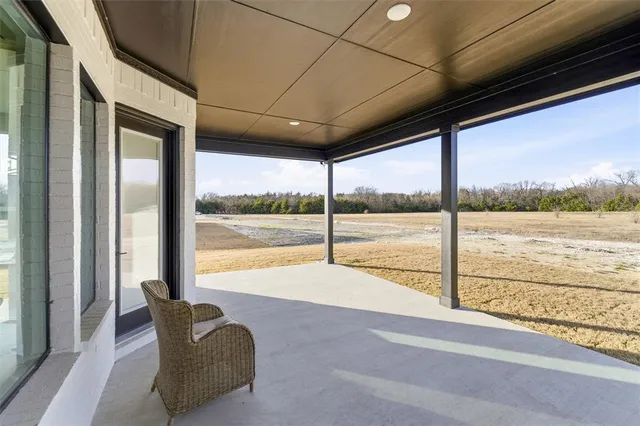 a view of a floor to ceiling window and an outdoor view