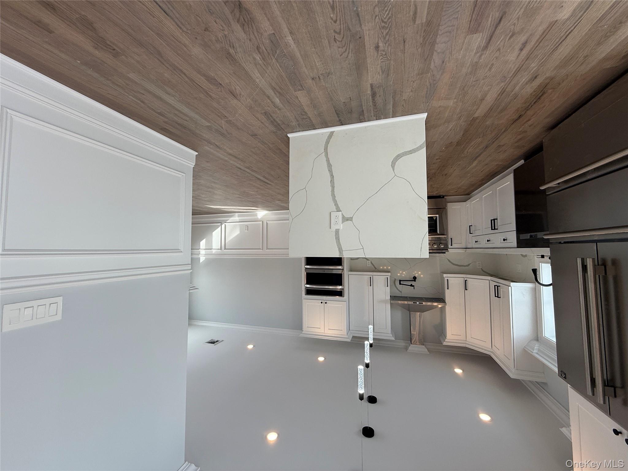 89 B Mount Sinai-Coram Road Coram, NY 11727 - Photo 7 of 22 a view of kitchen with wooden floor and electronic appliances