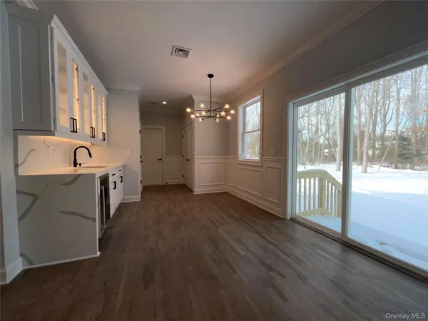 a open kitchen with cabinets a sink and appliances