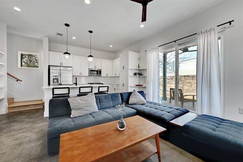 2812 East 4th Street, Unit 2 Austin, TX 78702 - Photo 5 of 26 Open-concept living space with concrete flooring