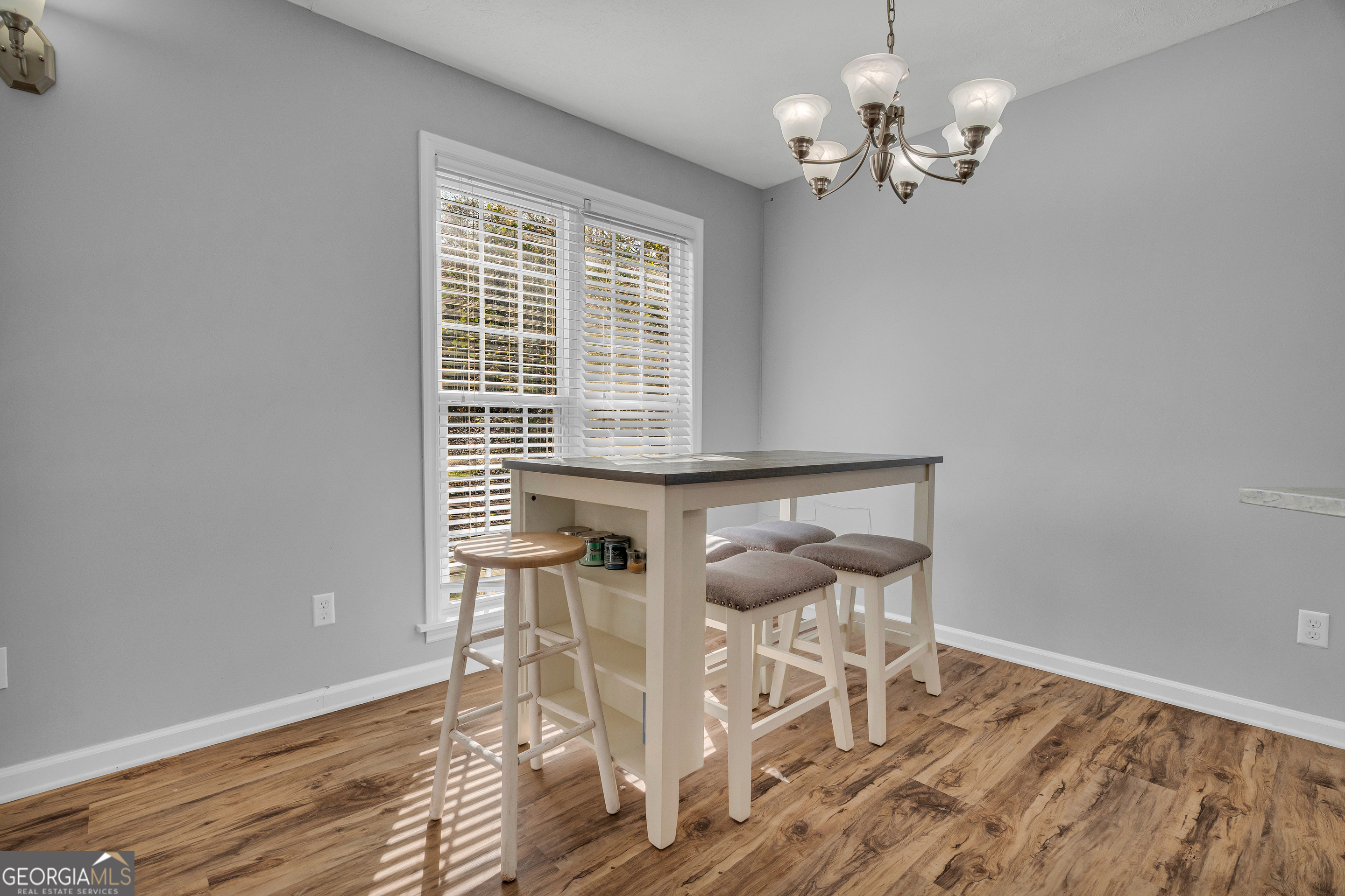 415 Ivory Drive Baldwin, GA 30511 - Photo 15 of 57 a view of a dining room with furniture wooden floor and chandelier