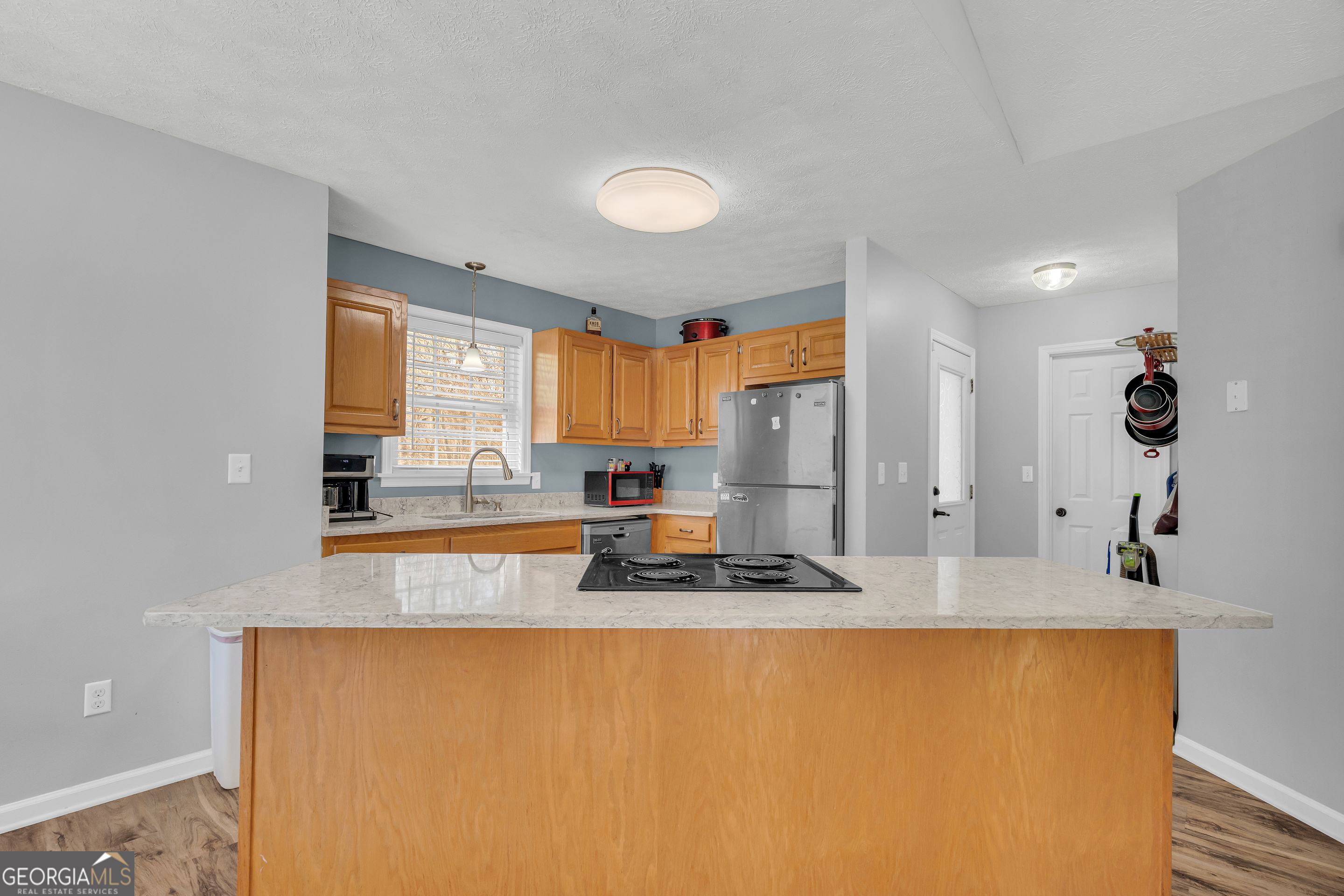 415 Ivory Drive Baldwin, GA 30511 - Photo 17 of 57 a kitchen with sink a window and appliances
