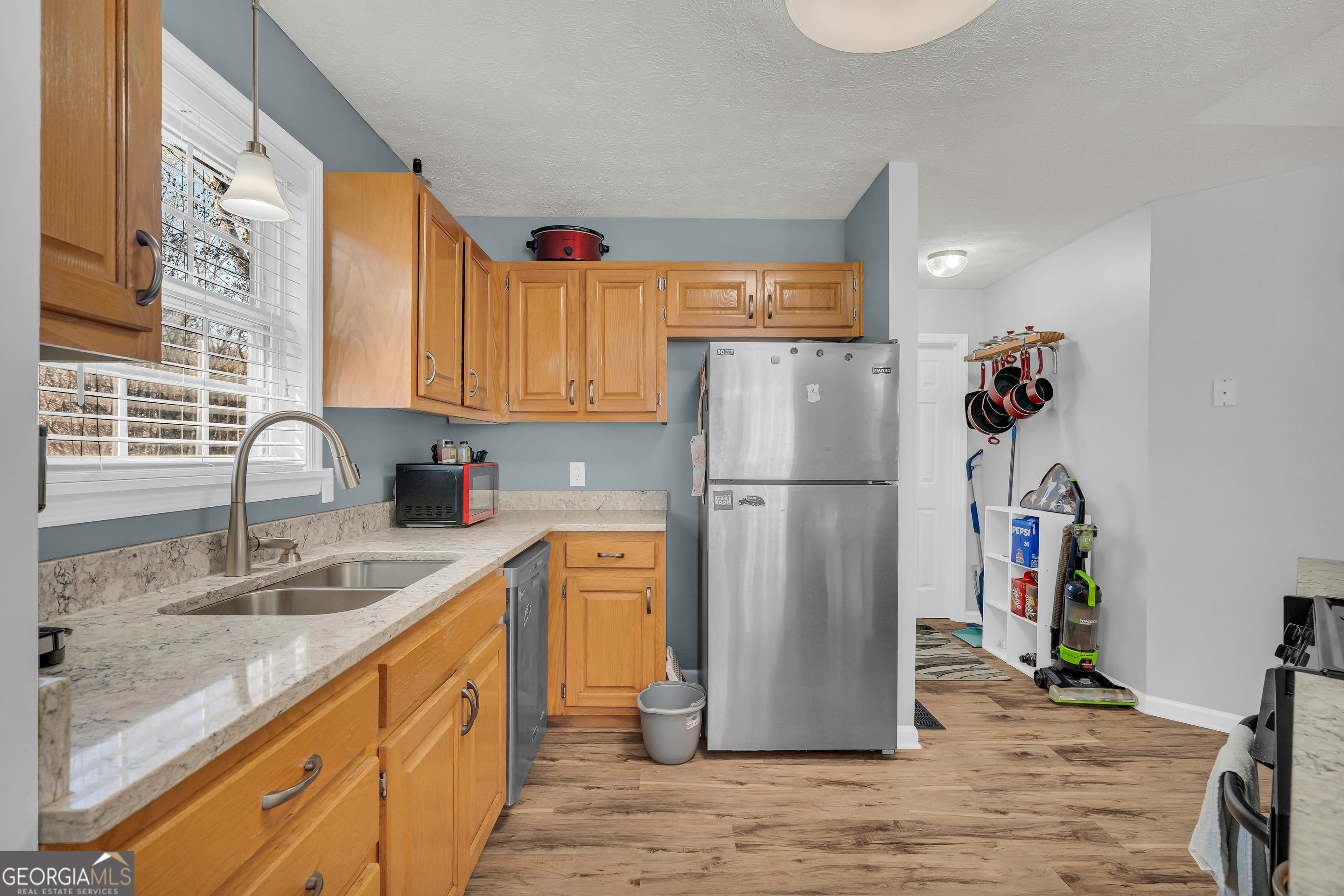 415 Ivory Drive Baldwin, GA 30511 - Photo 18 of 57 a kitchen with refrigerator and cabinets