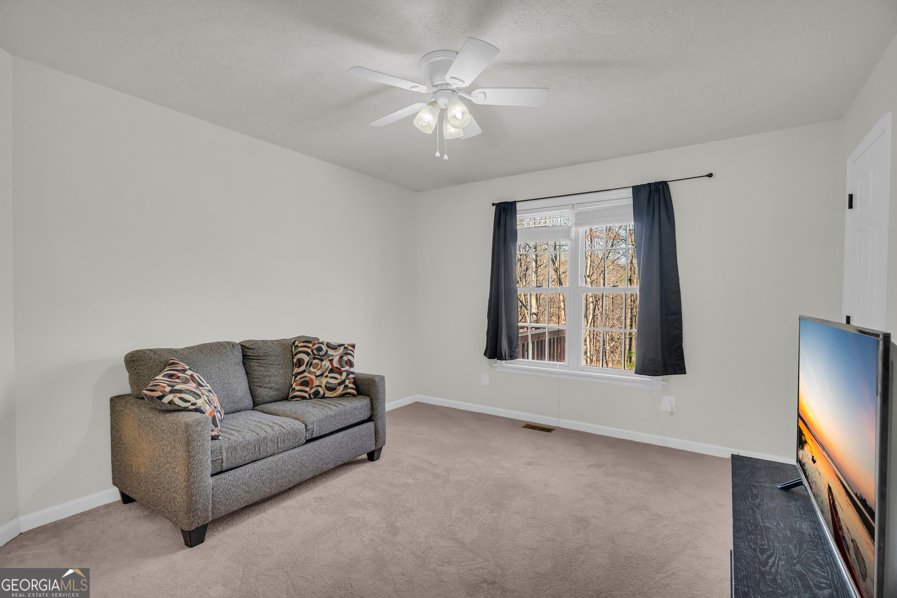 415 Ivory Drive Baldwin, GA 30511 - Photo 24 of 57 a living room with furniture and a large window