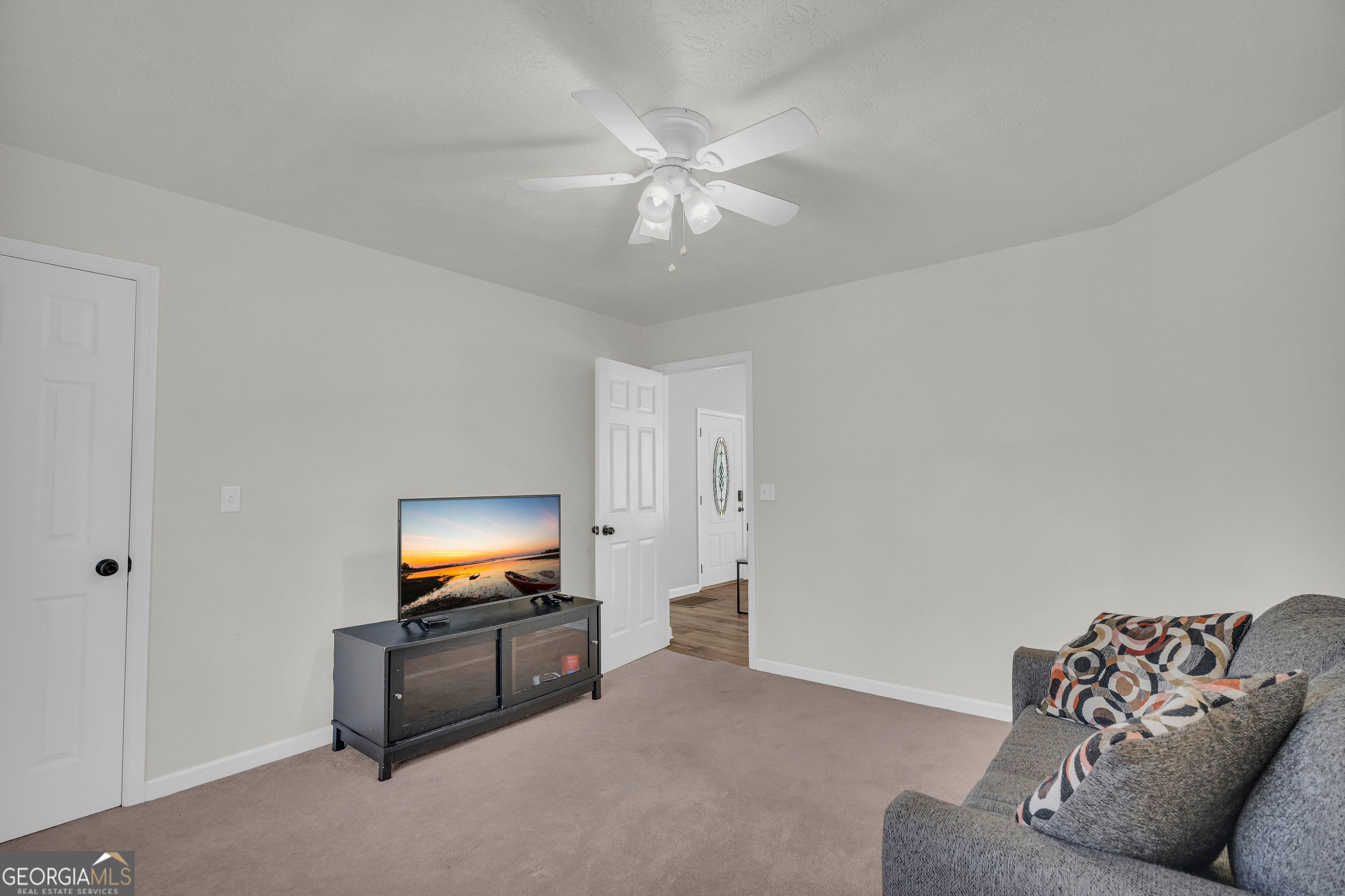 415 Ivory Drive Baldwin, GA 30511 - Photo 25 of 57 a living room with furniture and a flat screen tv