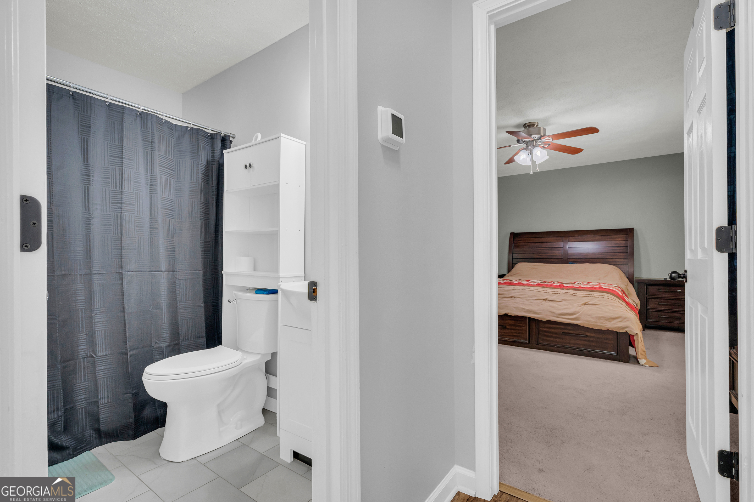 415 Ivory Drive Baldwin, GA 30511 - Photo 26 of 57 a bedroom with a bed and a painting on the wall