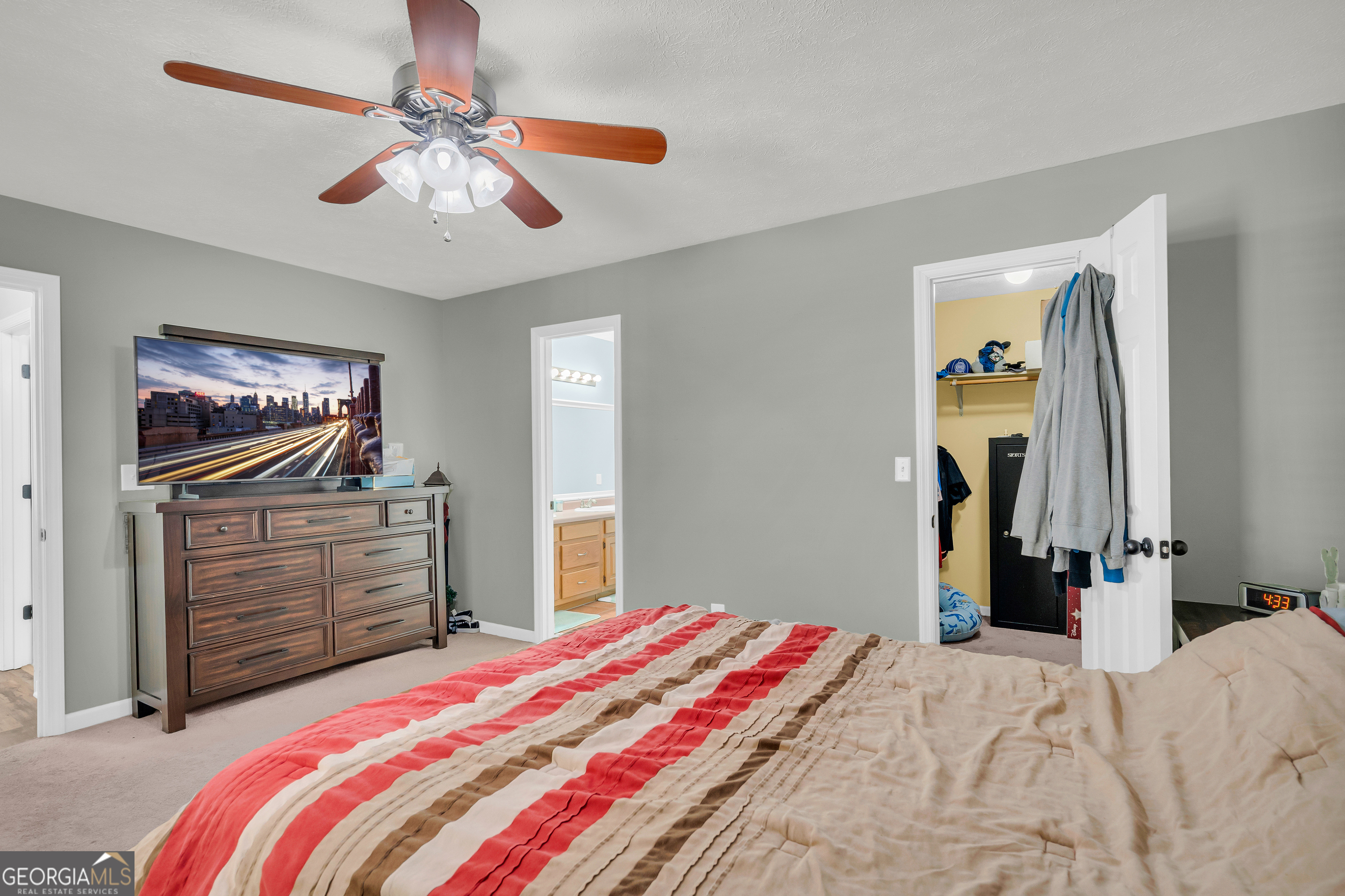 415 Ivory Drive Baldwin, GA 30511 - Photo 29 of 57 a bedroom with a bed and a flat screen tv