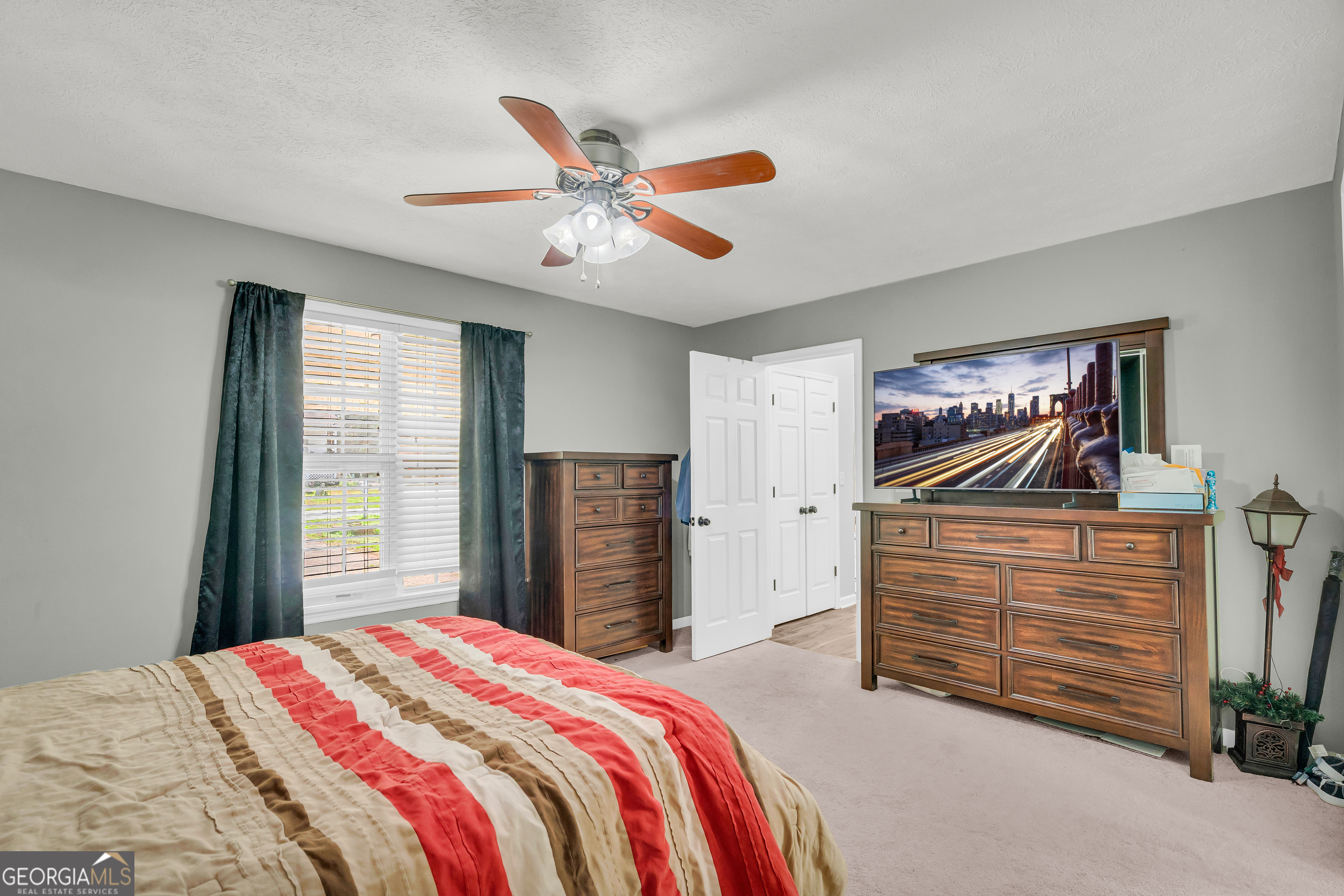 415 Ivory Drive Baldwin, GA 30511 - Photo 30 of 57 a bedroom with a bed and a chandelier