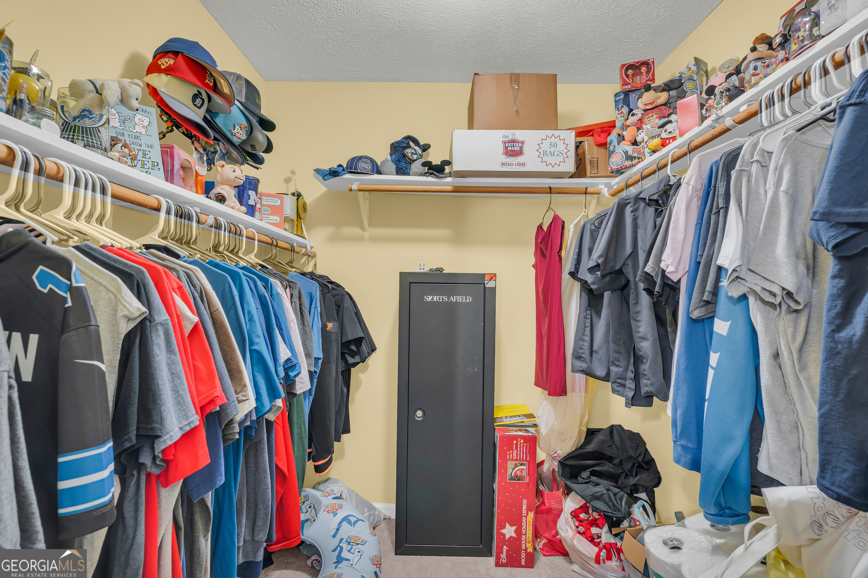 415 Ivory Drive Baldwin, GA 30511 - Photo 31 of 57 a view of walk in closet with clothes and shoes