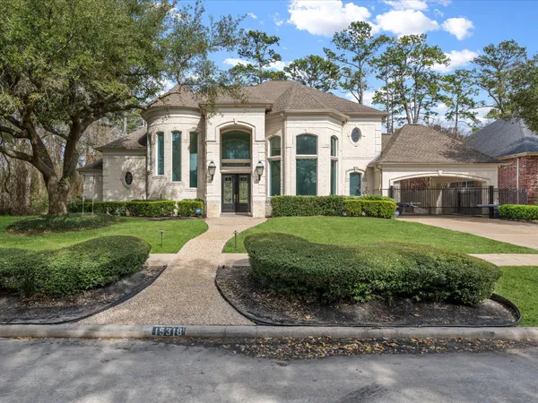 a view of house with yard and green space