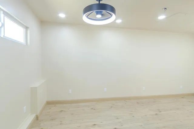 a view of empty room with a chandelier