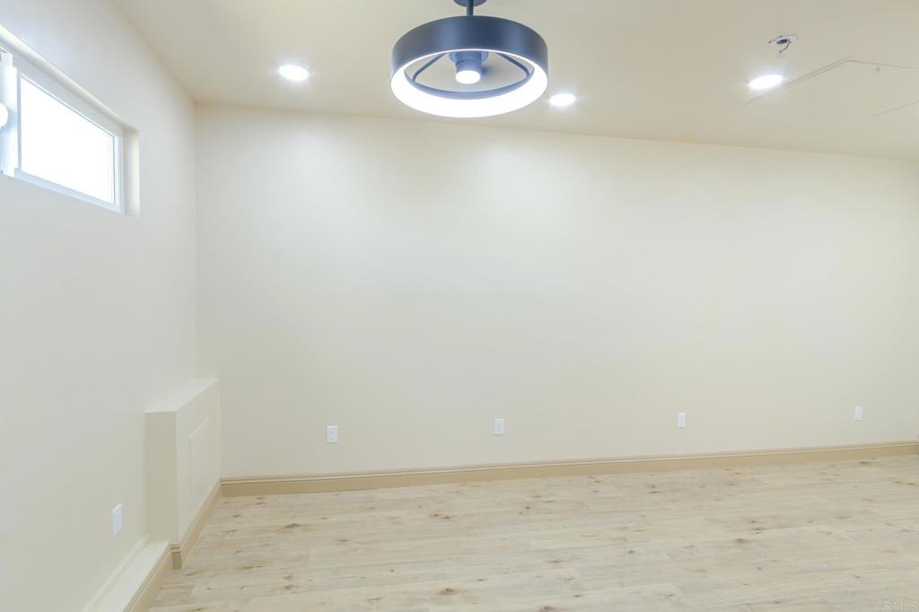 1174 Sea Strand Lane San Diego, CA 92154 - Photo 17 of 32 a view of a room with racks on the wall