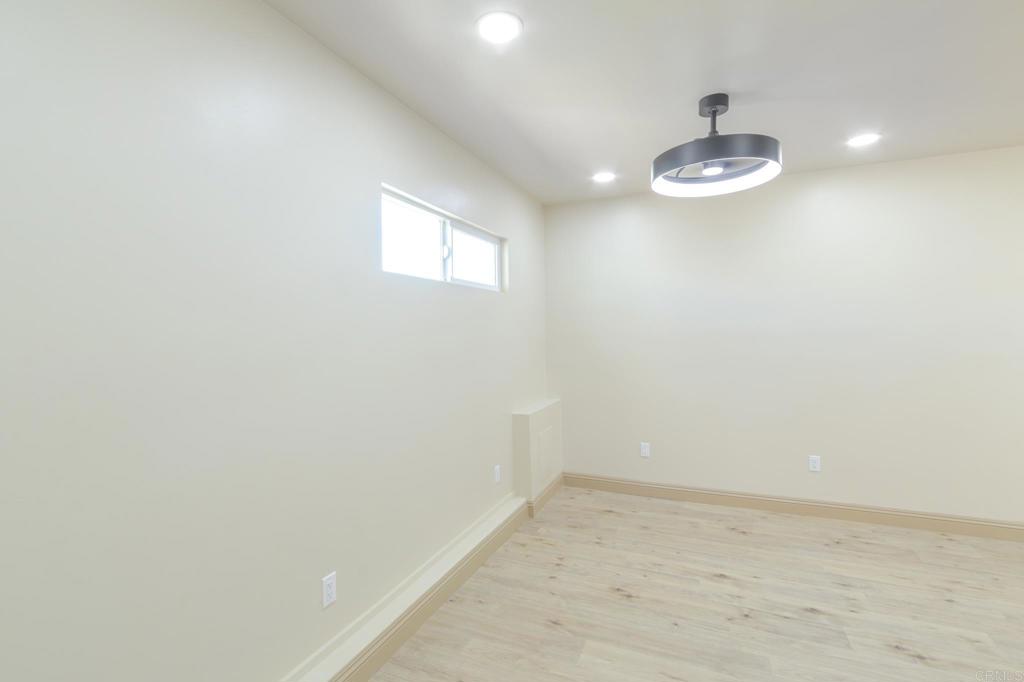 1174 Sea Strand Lane San Diego, CA 92154 - Photo 18 of 32 a view of empty room with a chandelier