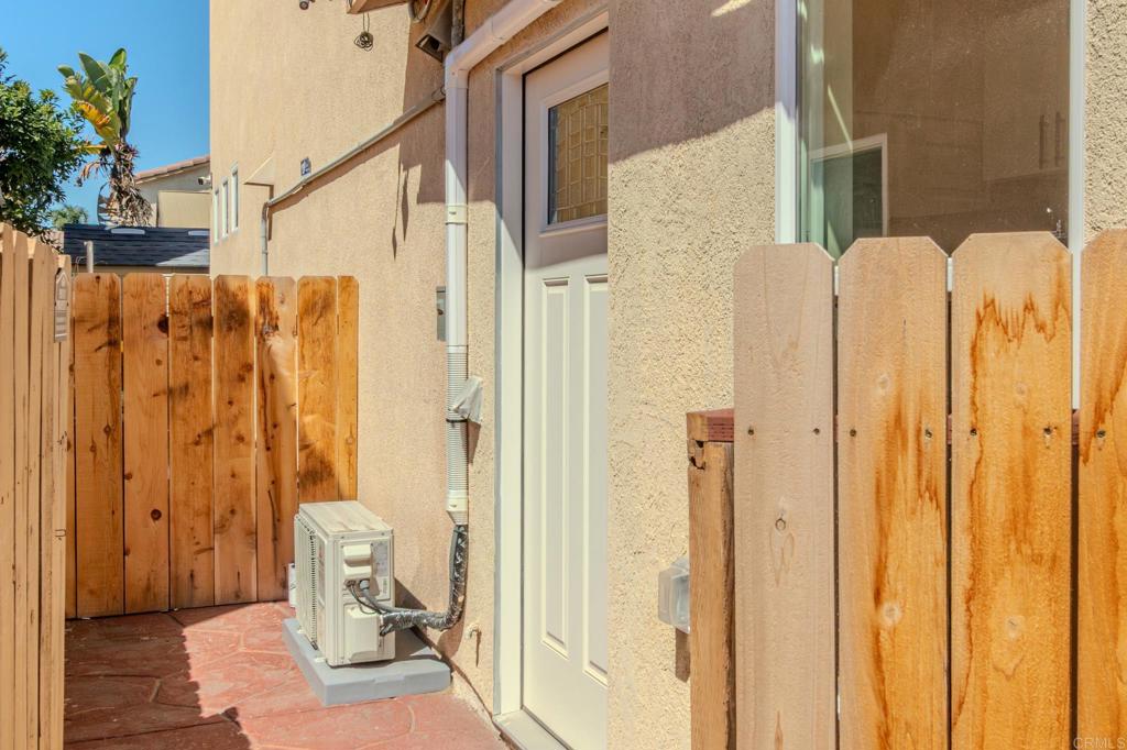 1174 Sea Strand Lane San Diego, CA 92154 - Photo 23 of 32 a bathroom with a granite countertop shower and a toilet