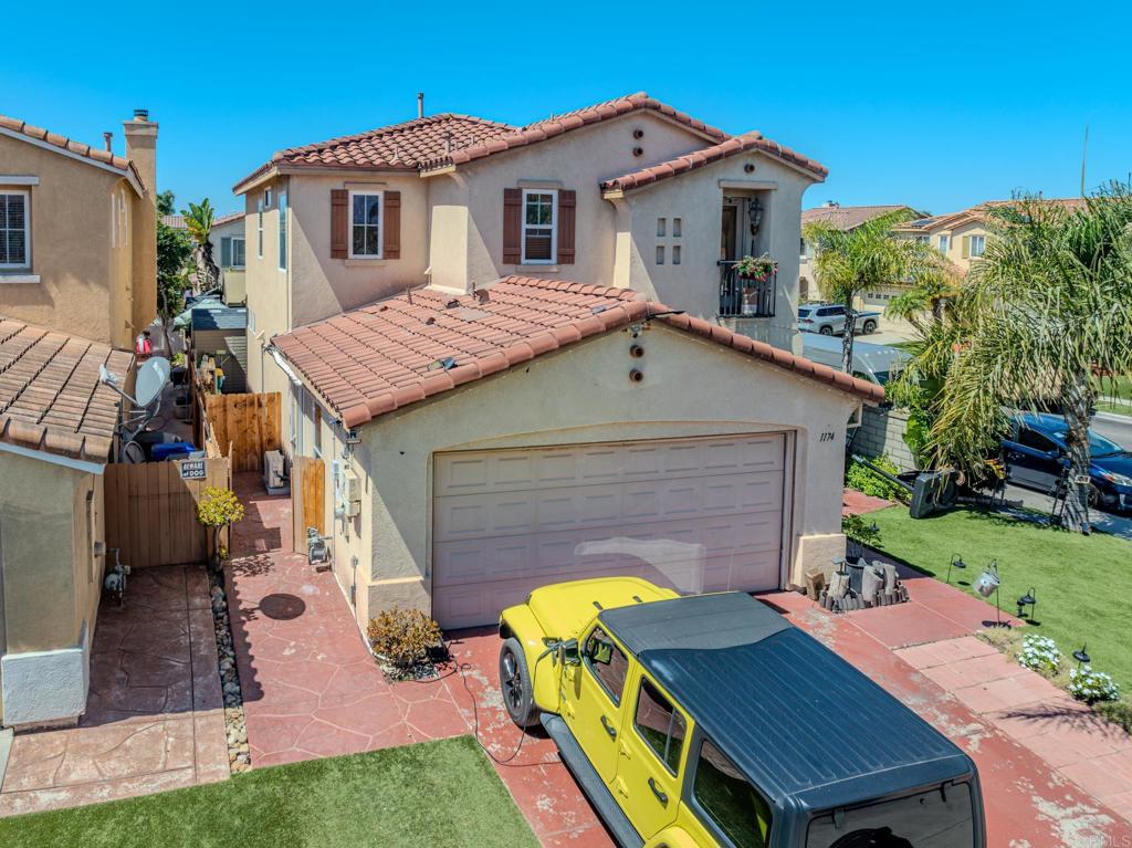 1174 Sea Strand Lane San Diego, CA 92154 - Photo 28 of 32 a view of a yard in front of house