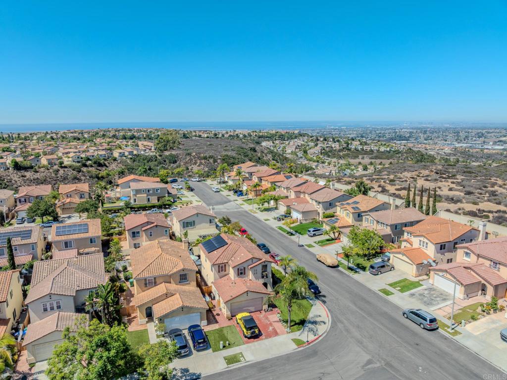 1174 Sea Strand Lane San Diego, CA 92154 - Photo 29 of 32 an aerial view of a city with lots of residential buildings in ocean