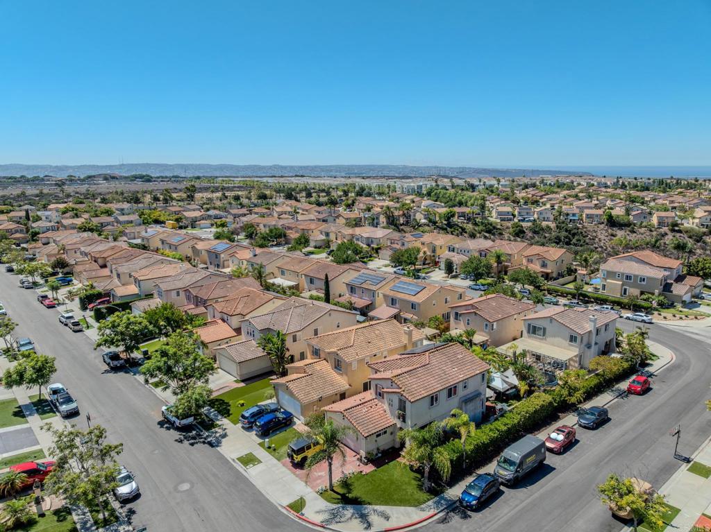 1174 Sea Strand Lane San Diego, CA 92154 - Photo 30 of 32 an aerial view of a city with lots of residential buildings