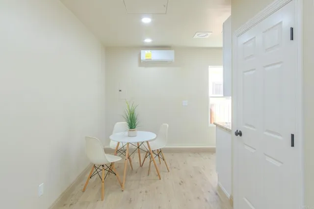a view of entryway with table and chair