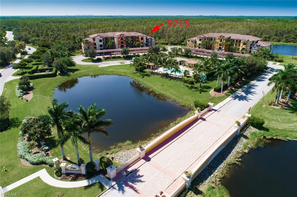 9715 Acqua Court, Unit 116 Naples, FL 34113 - Photo 16 of 33 a view of a house with a garden and lake view