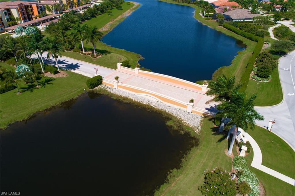 9715 Acqua Court, Unit 116 Naples, FL 34113 - Photo 17 of 33 a view of a lake with a yard