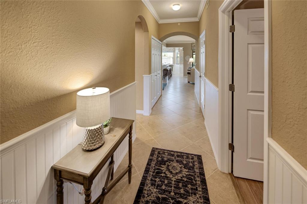 9715 Acqua Court, Unit 116 Naples, FL 34113 - Photo 2 of 33 a bathroom with a toilet and a mirror