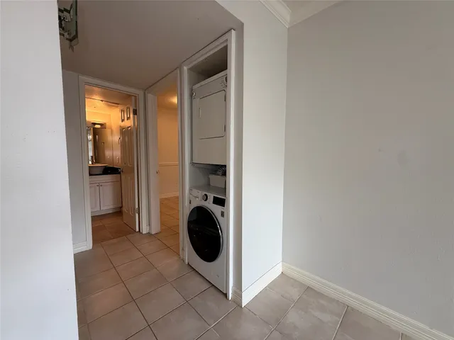 a bathroom with a bathtub shower sink vanity and toilet