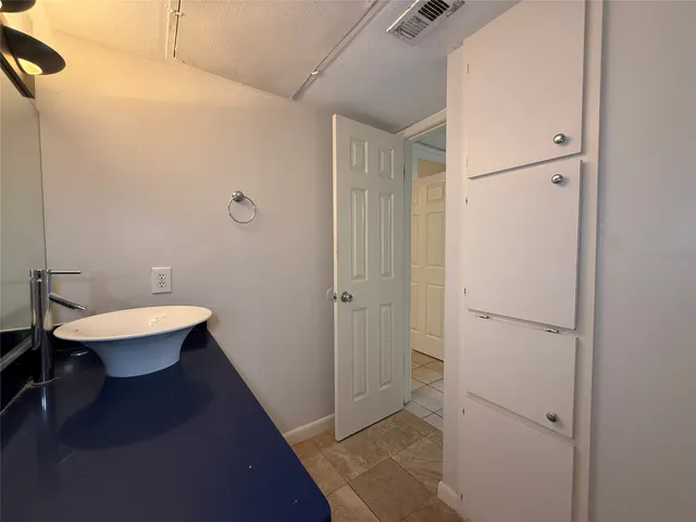 a view of a house with swimming pool and sitting area